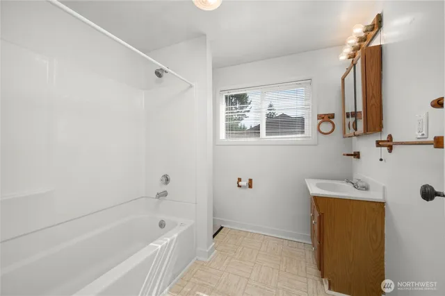 a view of a house with a yard and garage