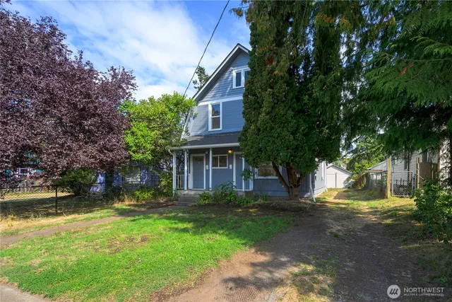 a view of a swimming pool with a bench and trees around