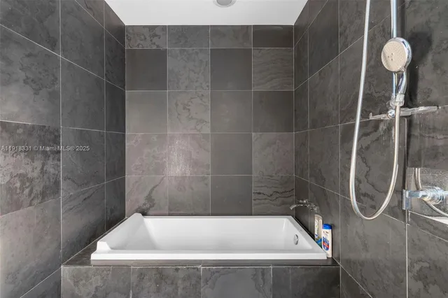 a bedroom with a bed and a fireplace