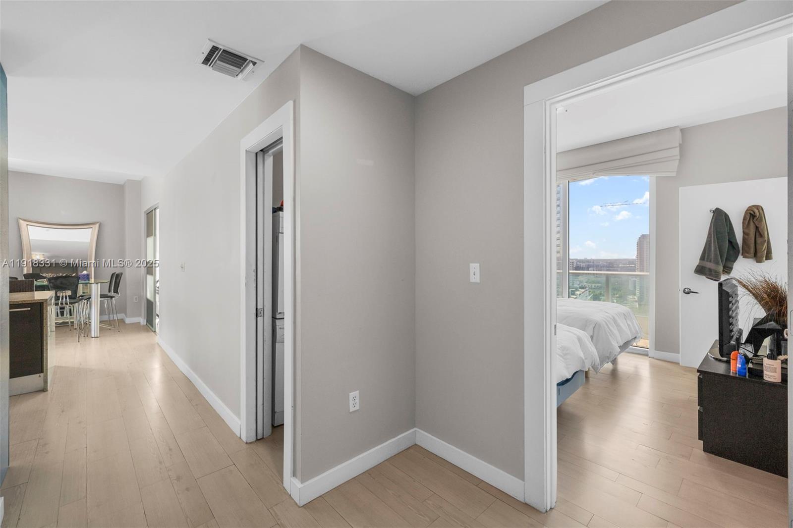 900 Biscayne Boulevard, Unit 2401 Miami, FL 33132 - Photo 3 of 33 a view of a livingroom with wooden floor and furniture