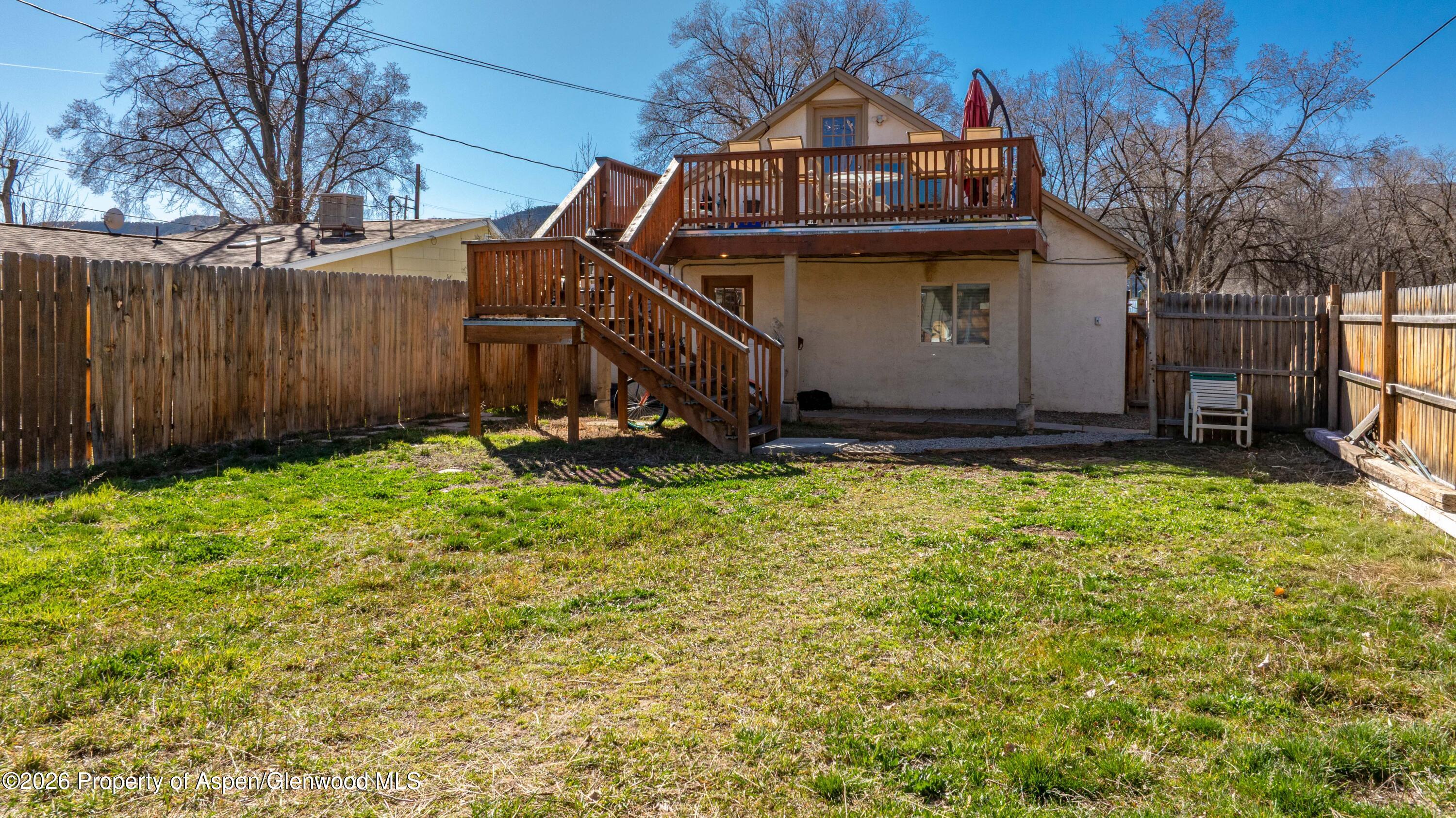 232 West 4th Street Rifle, CO 81650 - Photo 16 of 23 a view of a small yard in front of a house