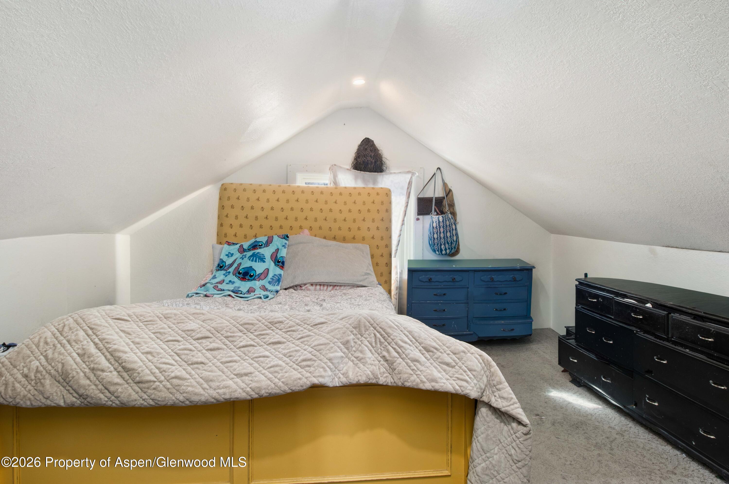 232 West 4th Street Rifle, CO 81650 - Photo 23 of 23 a bedroom with a bed and dresser