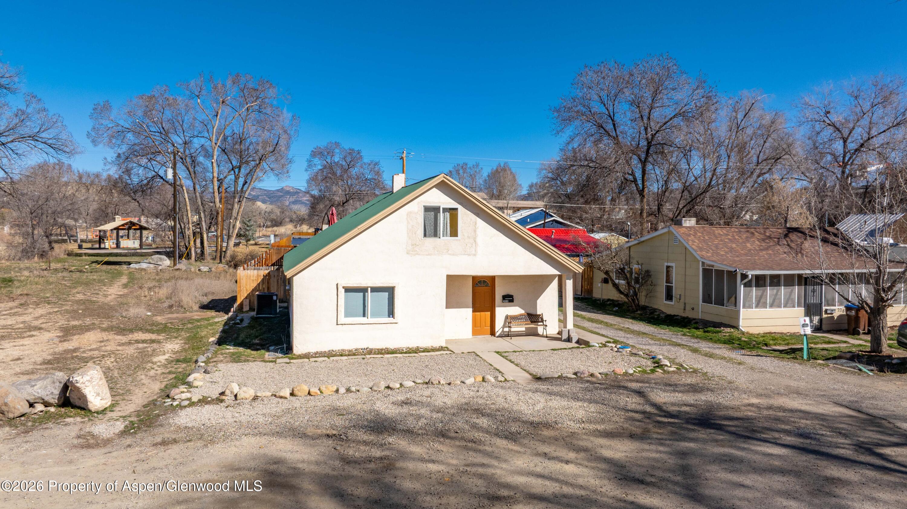 232 West 4th Street Rifle, CO 81650 - Photo 3 of 23 a view of a house with a yard covered in snow