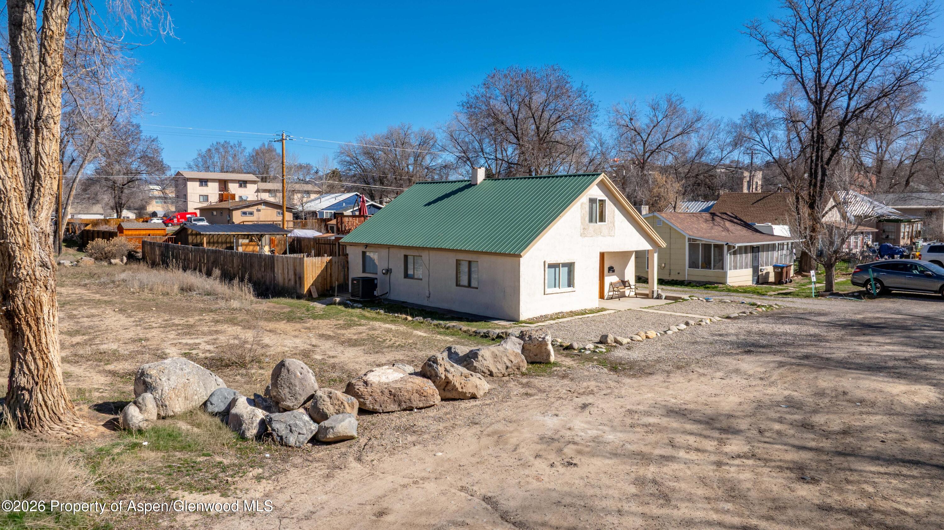 232 West 4th Street Rifle, CO 81650 - Photo 5 of 23 a view of a house with a yard covered in snow