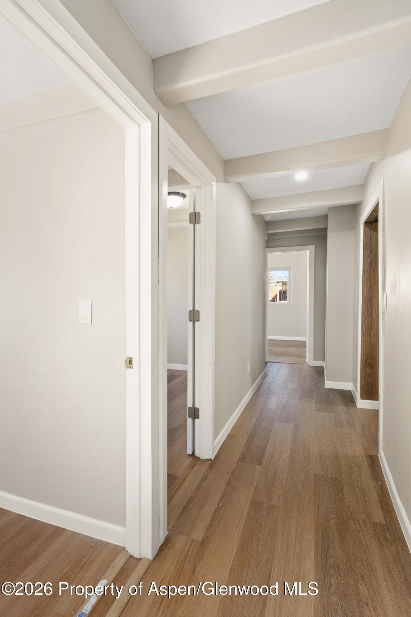 232 West 4th Street Rifle, CO 81650 - Photo 7 of 23 a view of a hallway with wooden floor