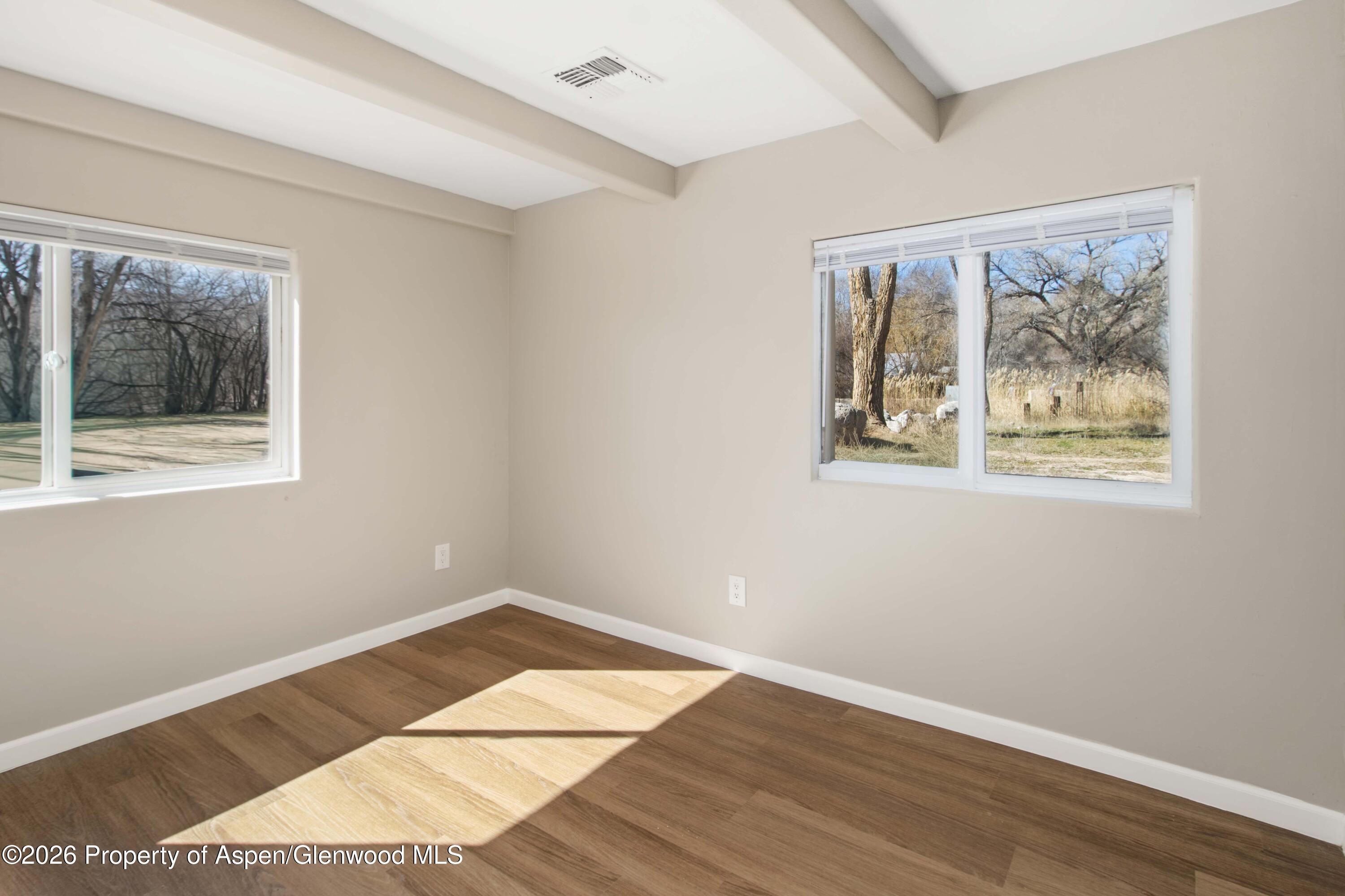 232 West 4th Street Rifle, CO 81650 - Photo 10 of 23 a view of a room with wooden floor and window