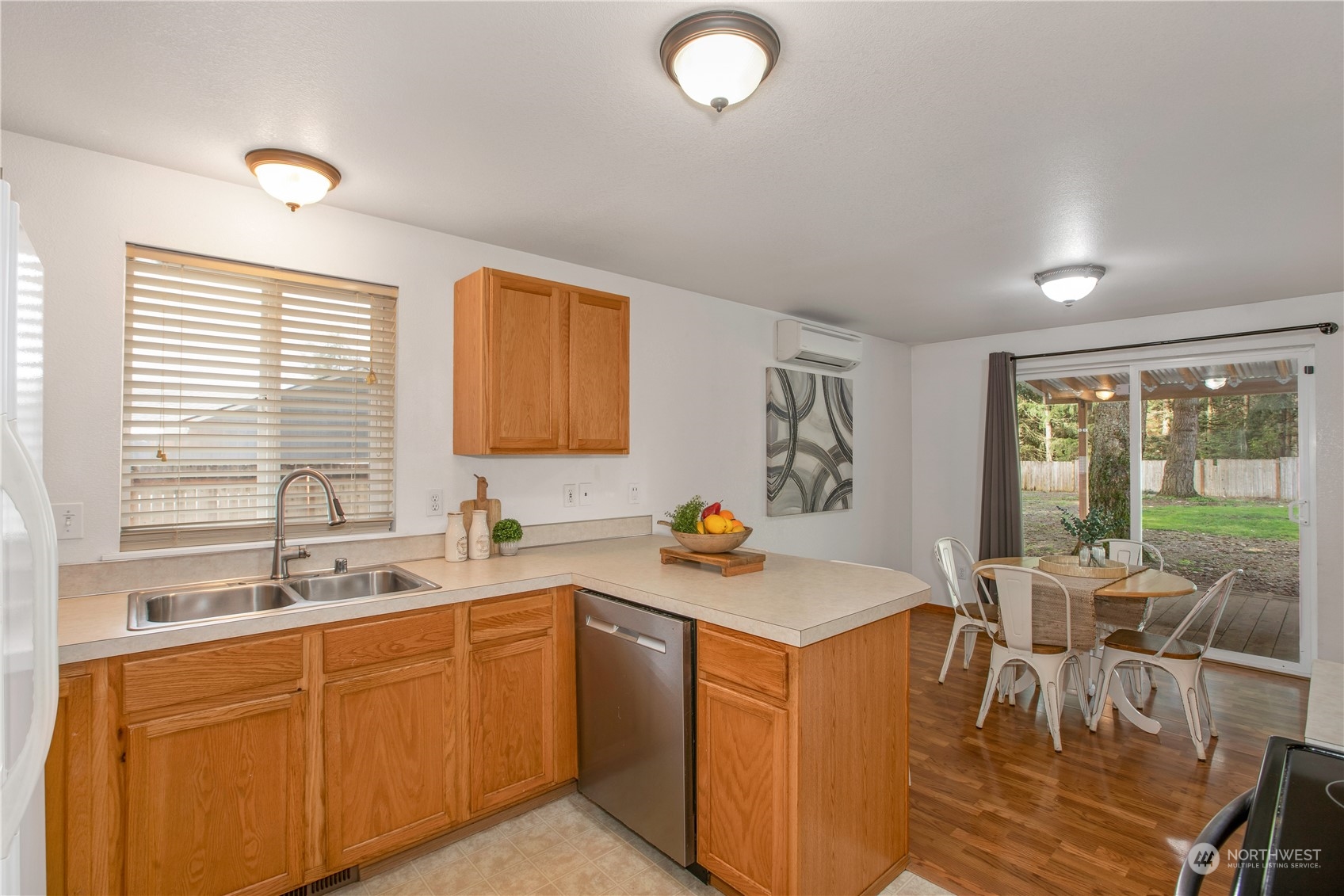 5430 187th Court Southwest Rochester, WA 98579 - Photo 12 of 34 a view of a kitchen counter top space with sink stainless steel appliances and furniture