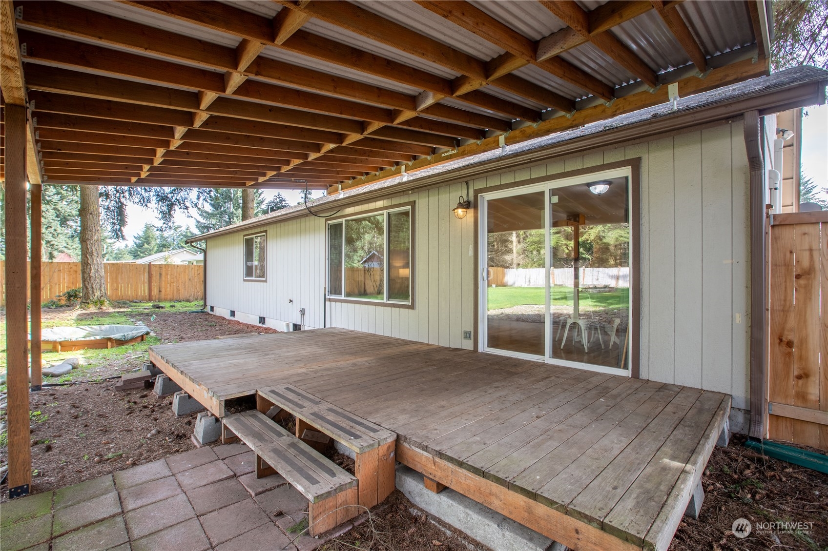 5430 187th Court Southwest Rochester, WA 98579 - Photo 23 of 34 a view of a backyard with table and chairs