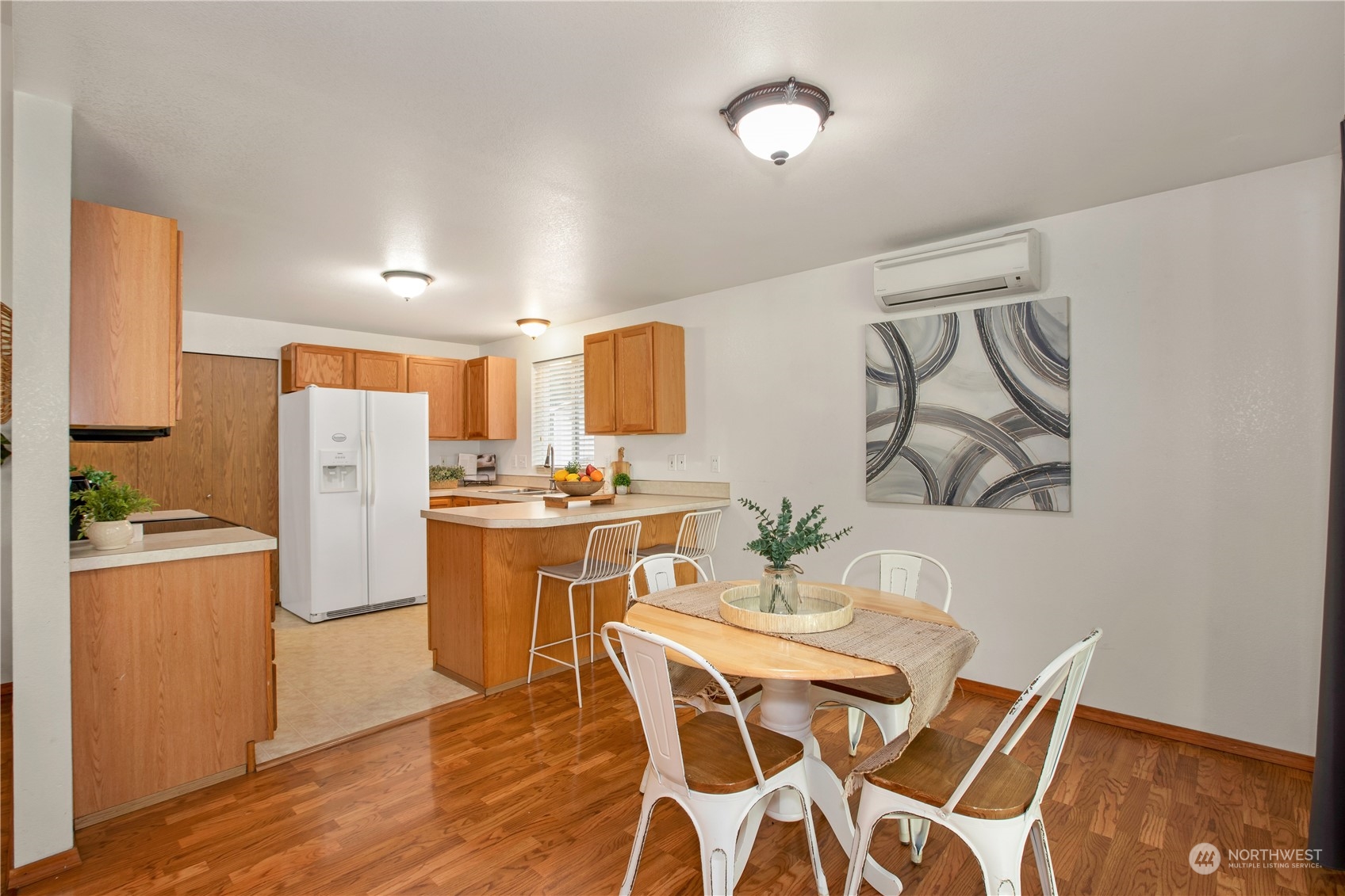 5430 187th Court Southwest Rochester, WA 98579 - Photo 9 of 34 a dining room with stainless steel appliances a dining table and chairs