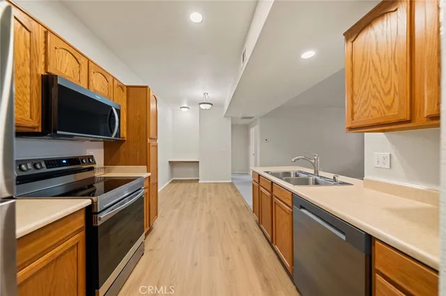 a kitchen with a sink stove and microwave