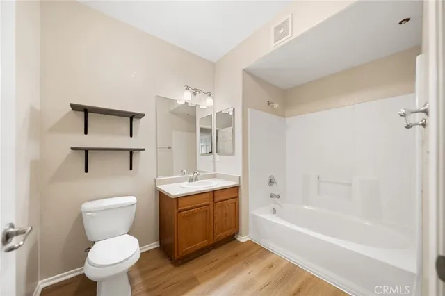 a bathroom with a toilet a sink and bathtub