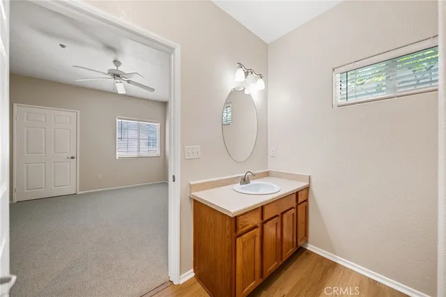 a bathroom with a sink a vanity and a mirror