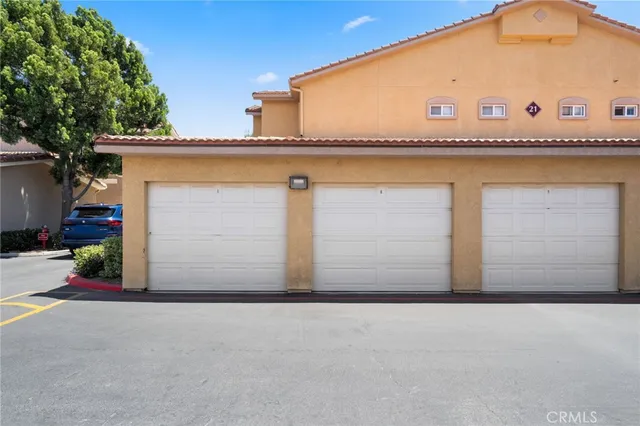 a front view of a house with garage