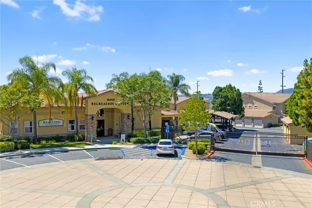 a sign board with yard in front of it