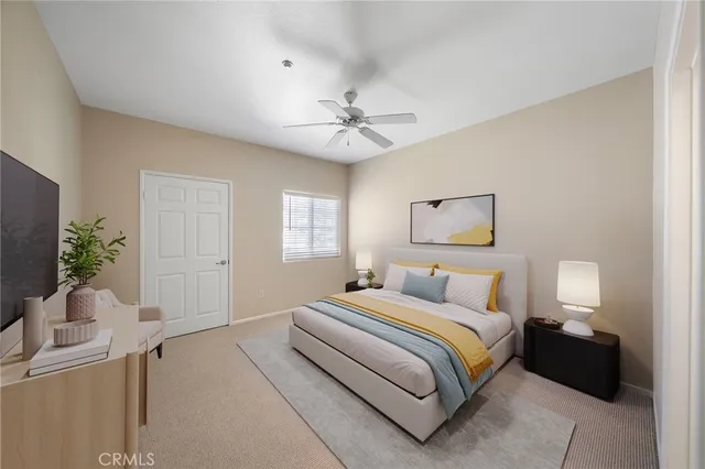 a bedroom with a bed and a potted plant