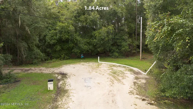 a swimming pool with trees in the background