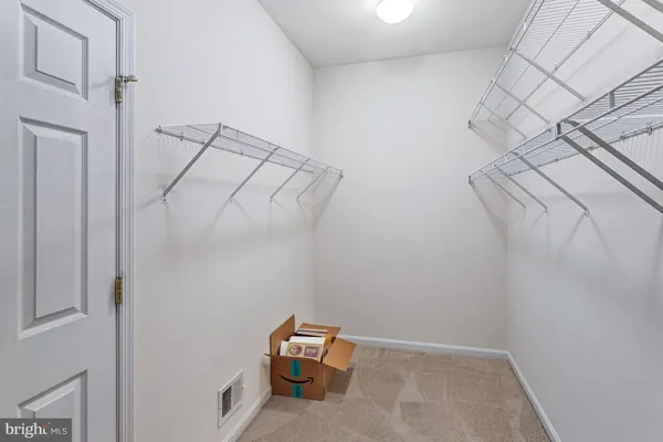 a view of room with racks on the wall