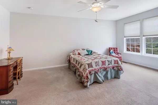 a utility room with cabinets washer and dryer