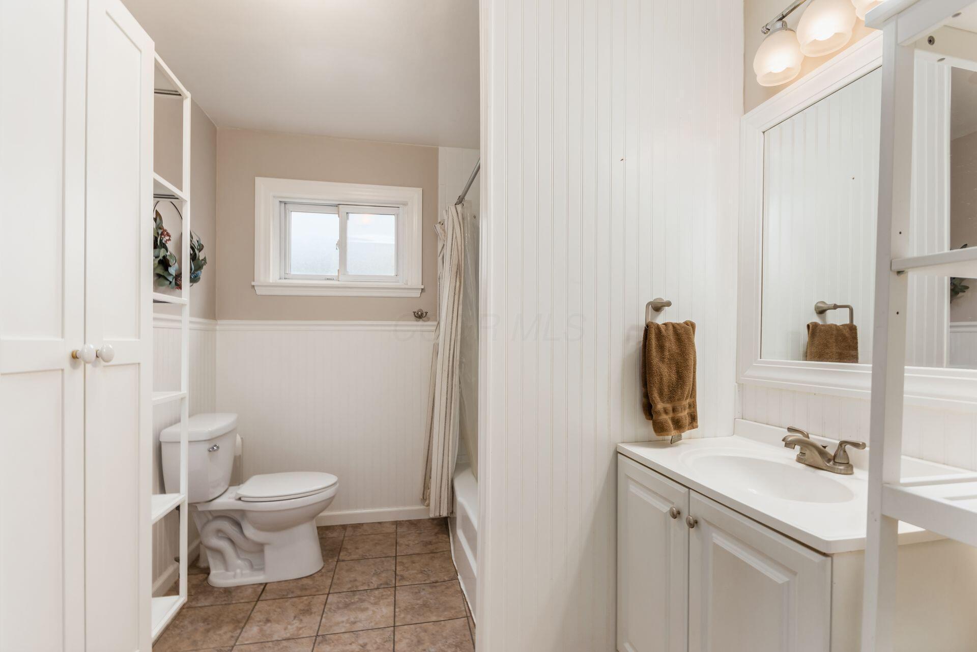 9221 London Road Orient, OH 43146 - Photo 25 of 51 Upstairs Bath with tub/shower combo and updated vanity and storage.
