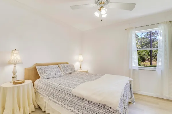 a bedroom with a bed and a lamp