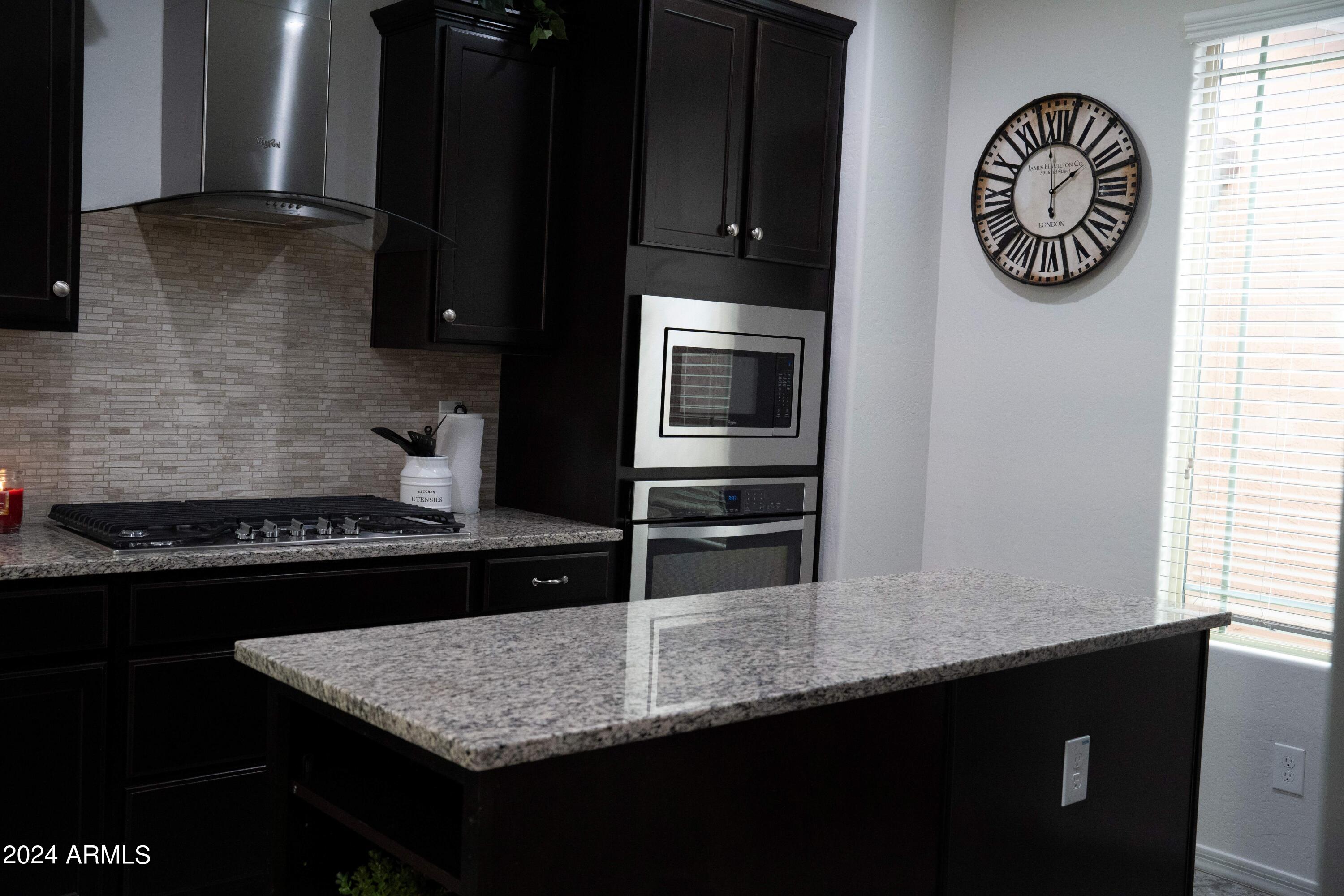 2610 West Royer Road Phoenix, AZ 85085 - Photo 17 of 40 Kitchen Island & Gas Stove