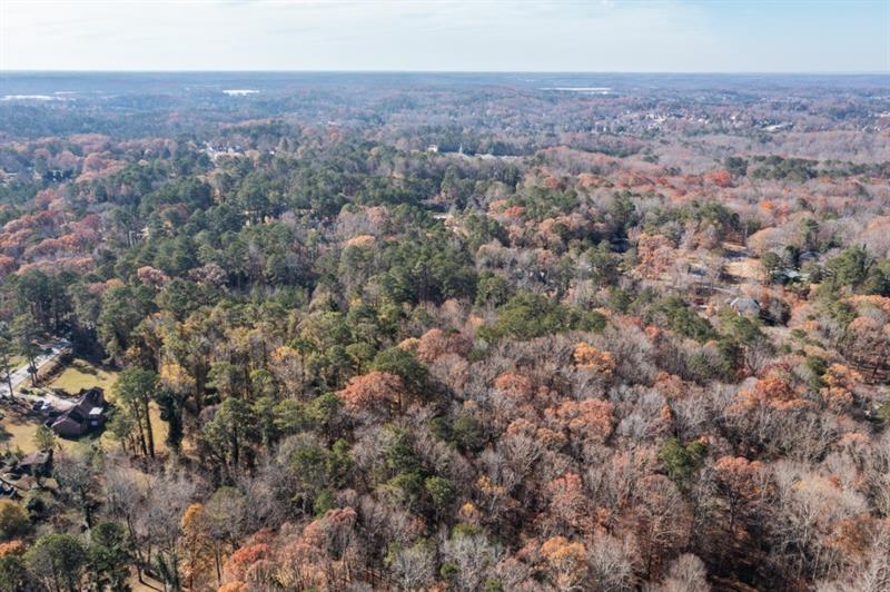 3895 Old Fairburn Road Atlanta, GA 30331 - Photo 9 of 14 an aerial view of house with yard and mountain view in back