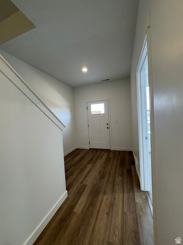 1883 West 1575th North, Unit 236 Layton, UT 84041 - Photo 2 of 22 Entrance foyer featuring baseboards and dark wood-style floors