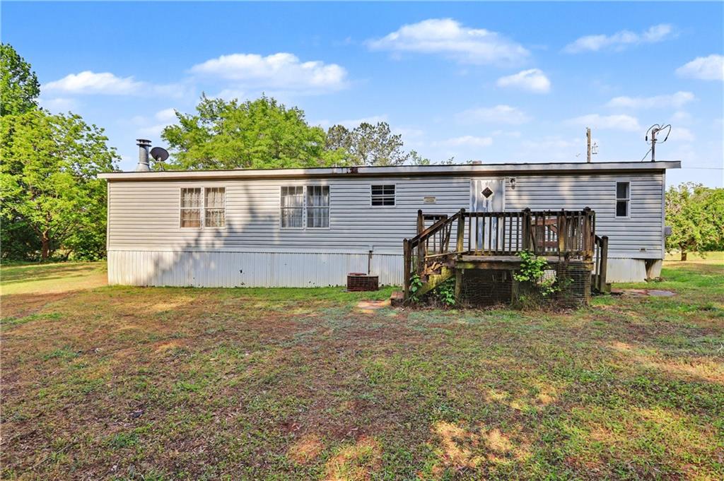 249 John Golden Road Temple, GA 30179 - Photo 11 of 45 a view of a house with backyard and sitting area