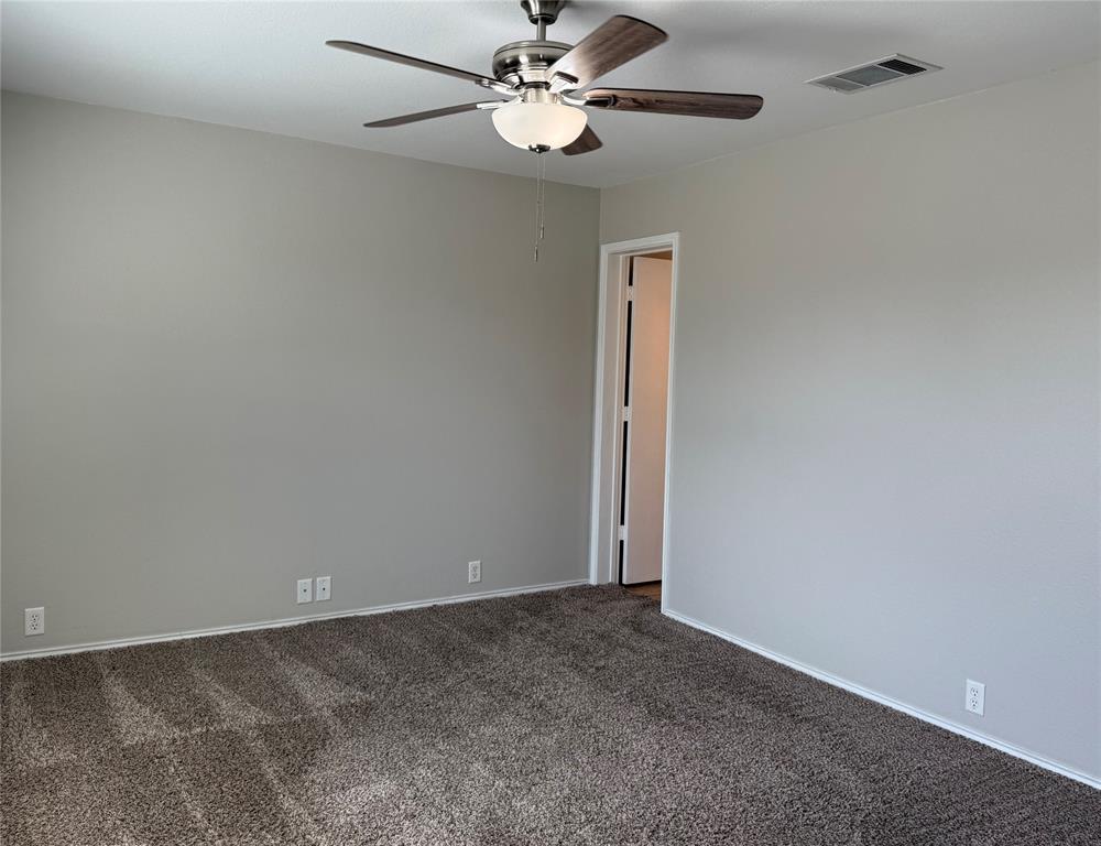 4514 Quail Run Road Sherman, TX 75092 - Photo 13 of 34 Unfurnished room with carpet flooring and ceiling fan