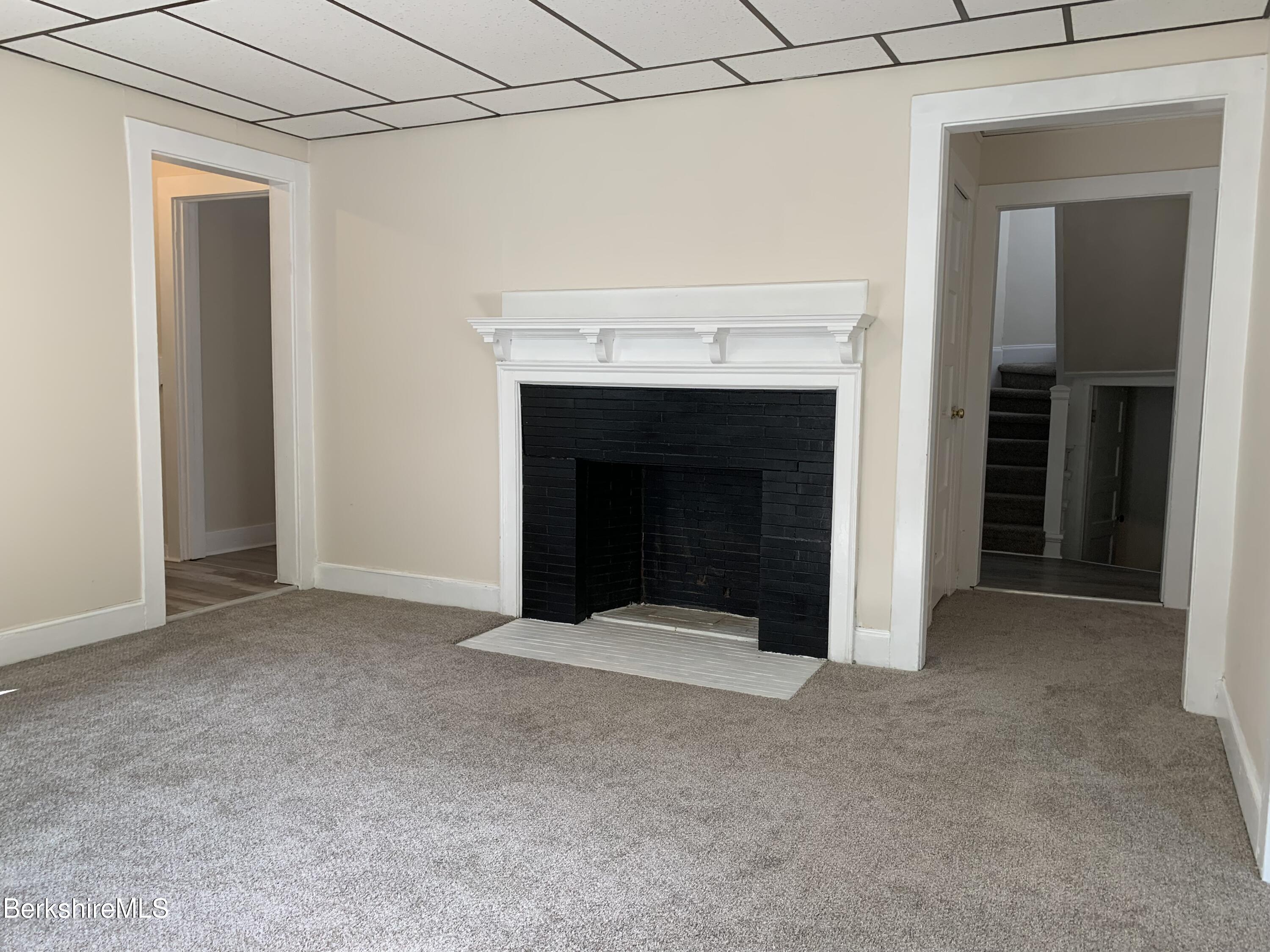 22 Copley Terrace Pittsfield, MA 01201 - Photo 14 of 42 a view of an empty room with a fireplace