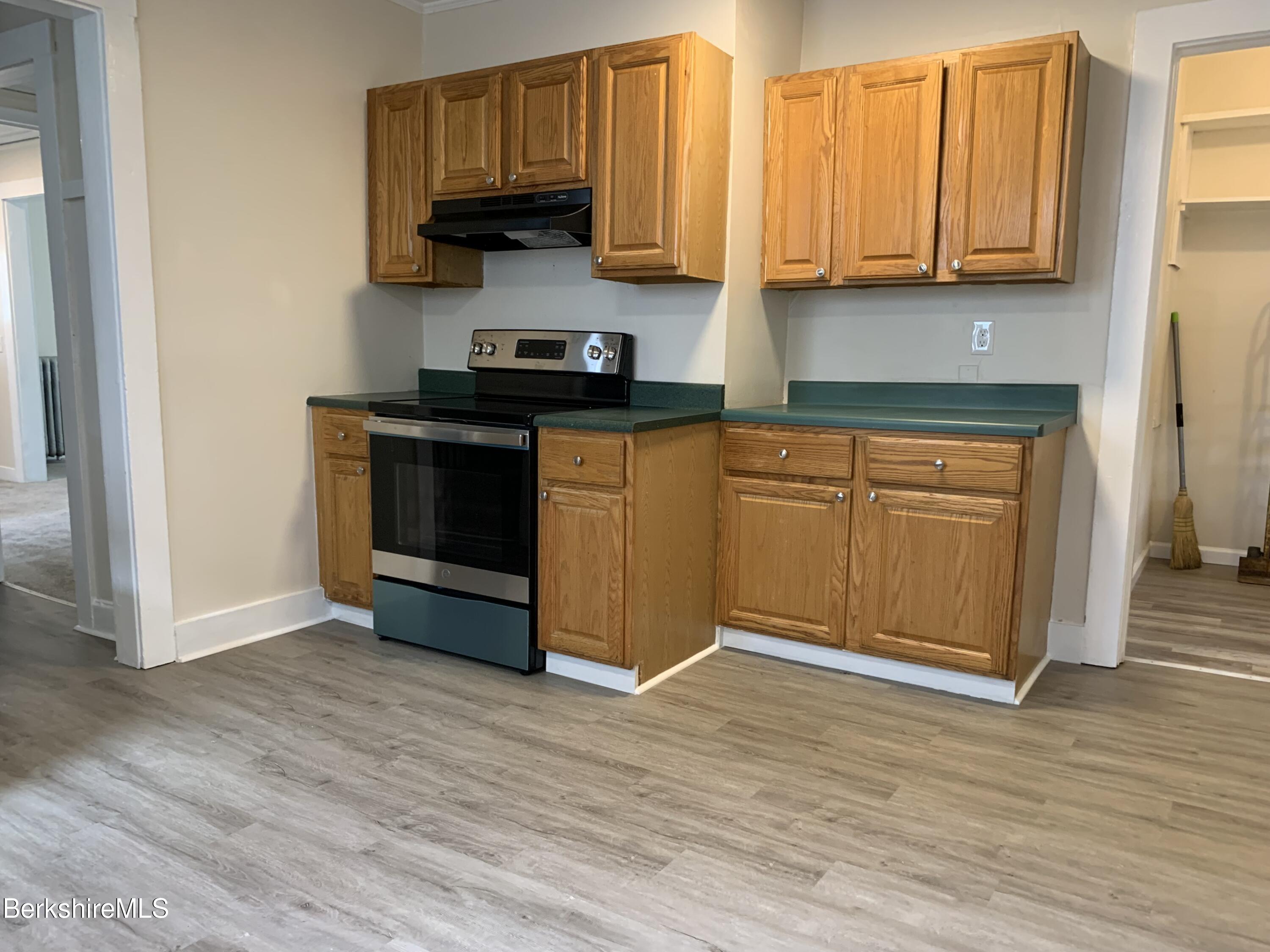 22 Copley Terrace Pittsfield, MA 01201 - Photo 19 of 42 a kitchen with stainless steel appliances granite countertop a stove a sink and a refrigerator
