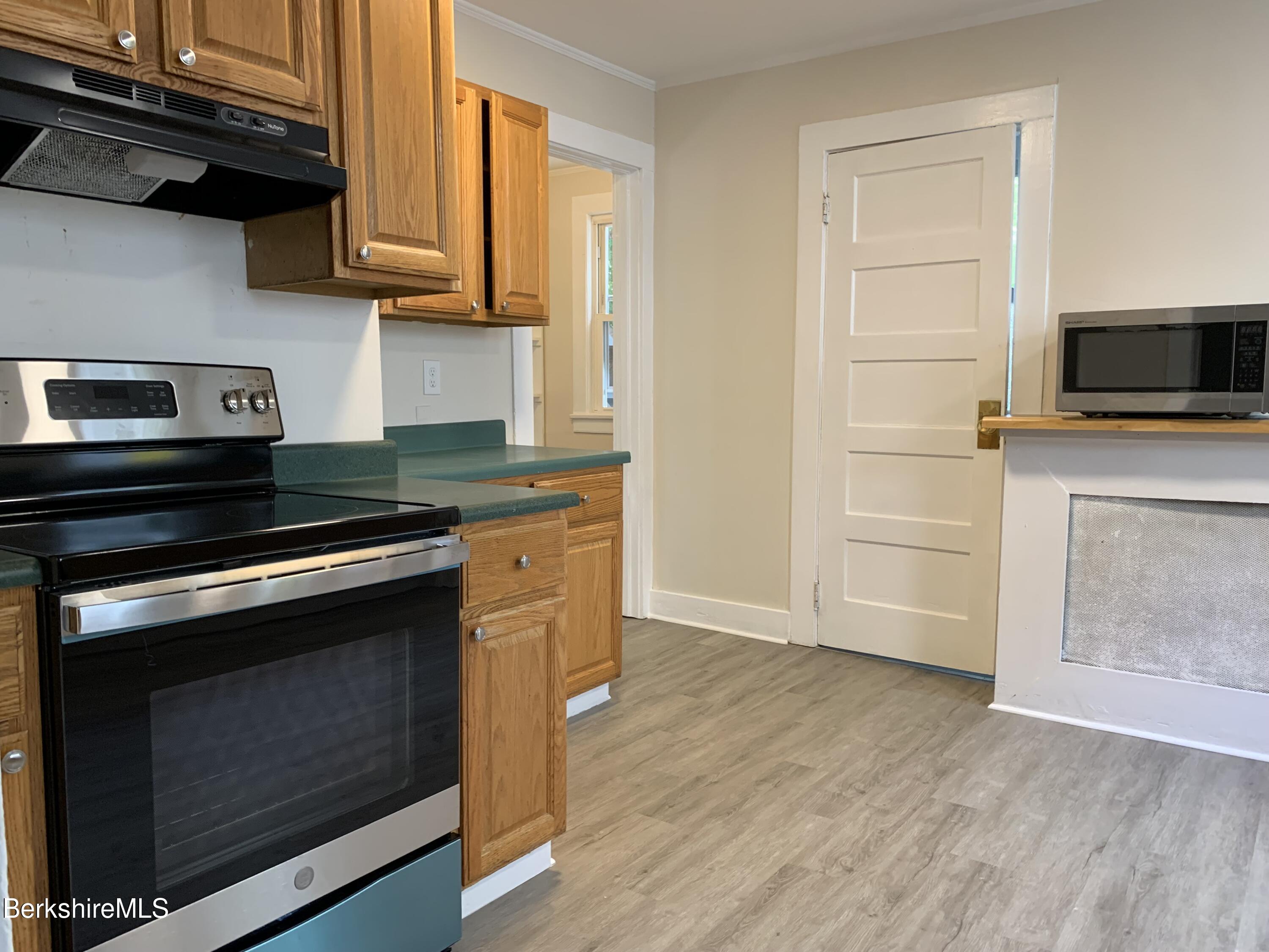 22 Copley Terrace Pittsfield, MA 01201 - Photo 21 of 42 a kitchen with a stove and a microwave