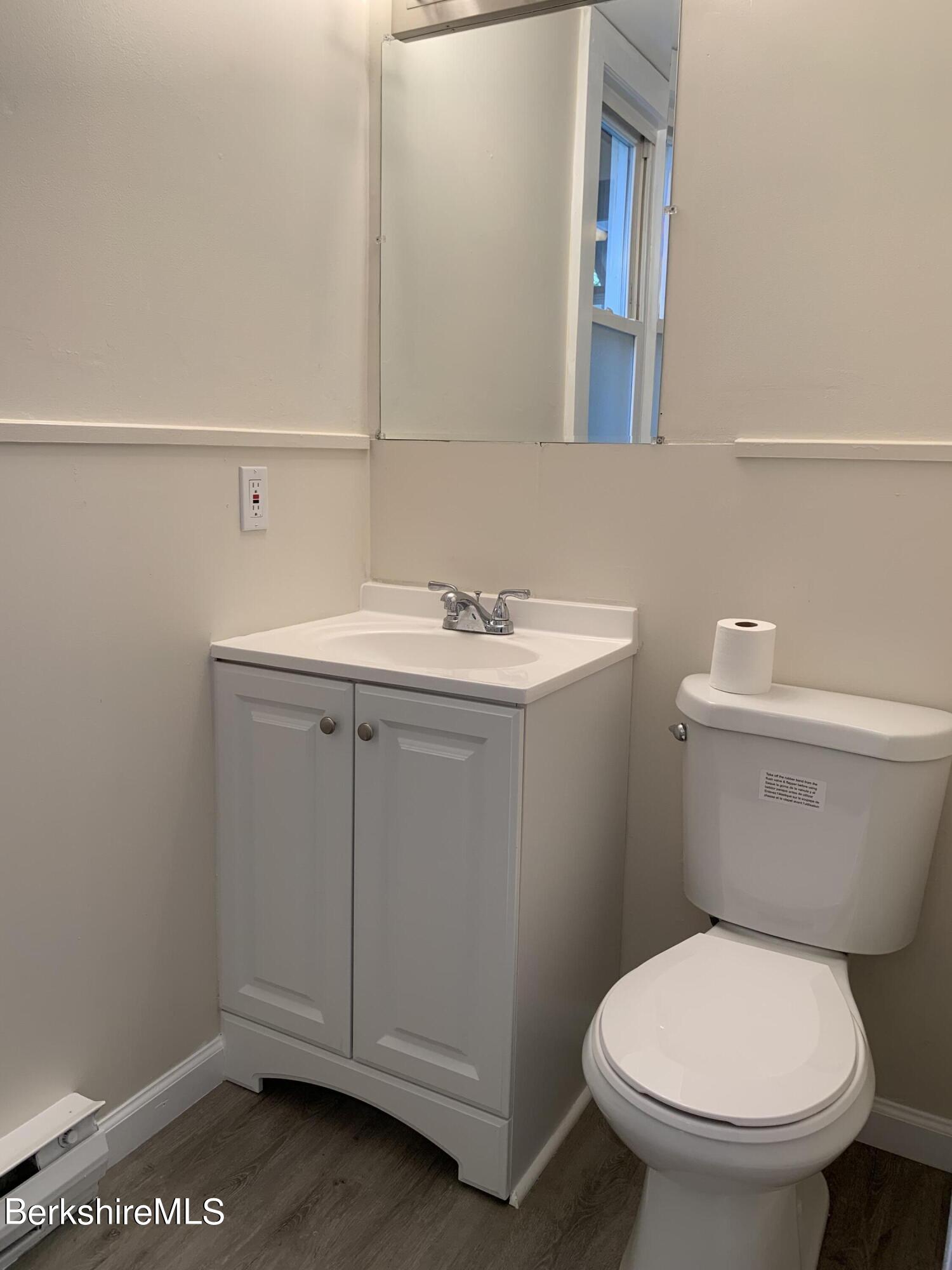 22 Copley Terrace Pittsfield, MA 01201 - Photo 24 of 42 a bathroom with a toilet a sink and mirror