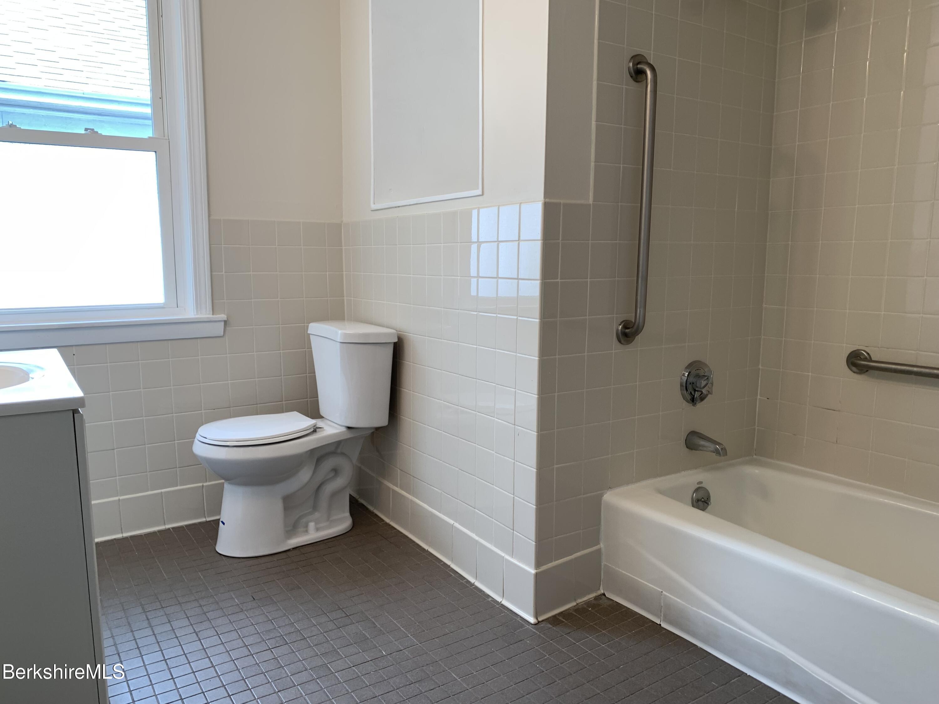 22 Copley Terrace Pittsfield, MA 01201 - Photo 36 of 42 a bathroom with a white toilet and a bathtub
