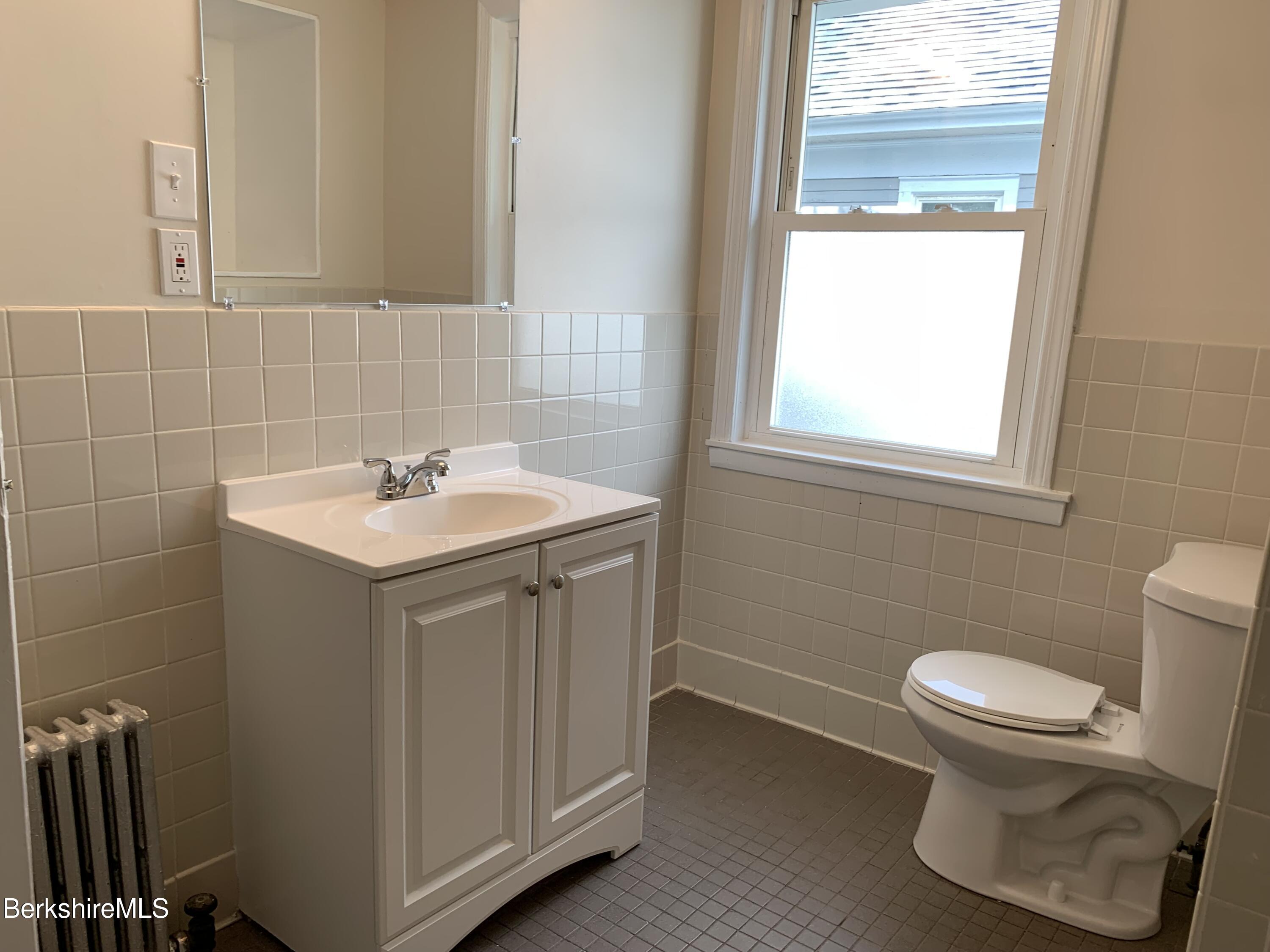22 Copley Terrace Pittsfield, MA 01201 - Photo 37 of 42 a bathroom with a sink toilet and a mirror