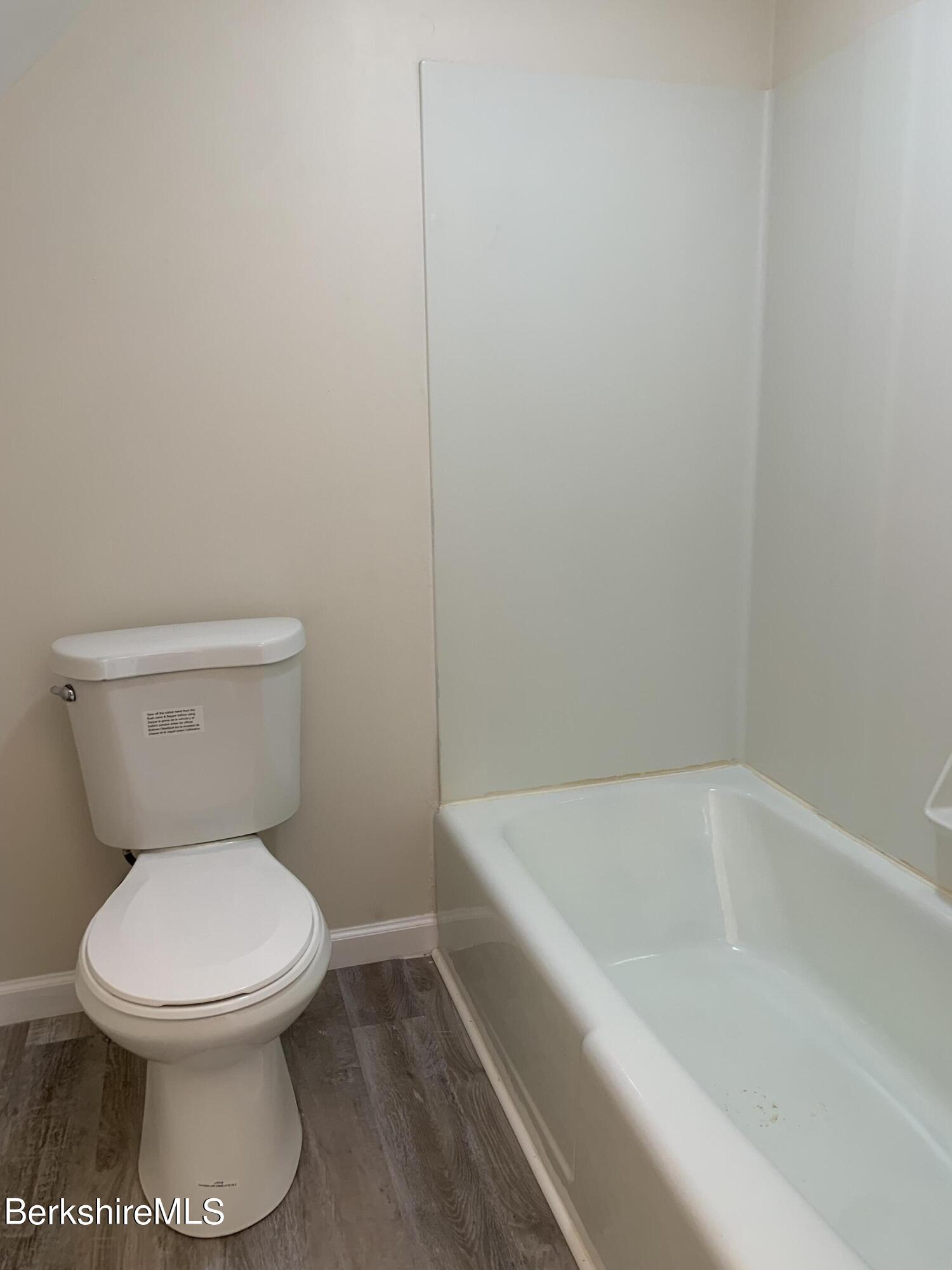 22 Copley Terrace Pittsfield, MA 01201 - Photo 41 of 42 a white toilet sitting next to a bath tub