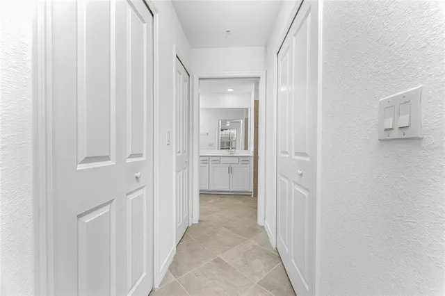 a view of a hallway with a wooden door