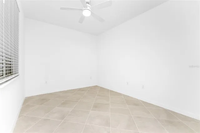 an empty room with a fan