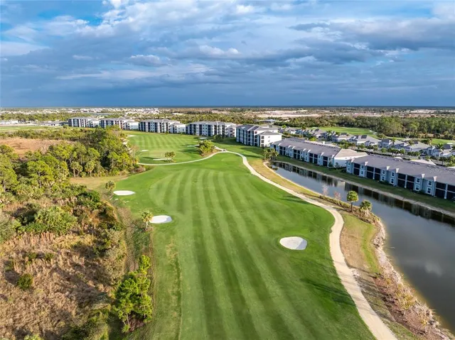 a view of a swimming pool with an outdoor seating