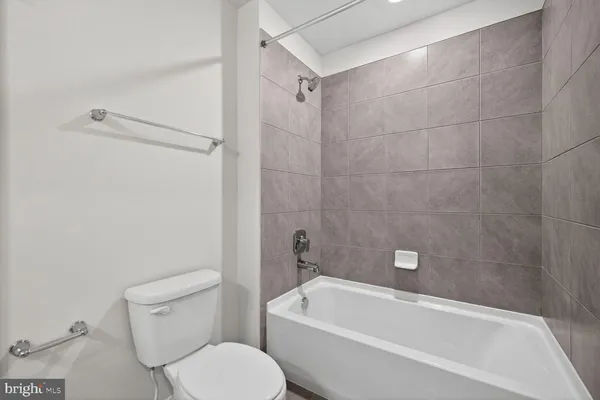 a view of a room with an empty space and a sink