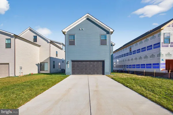 a picture of a bench in front of a wall