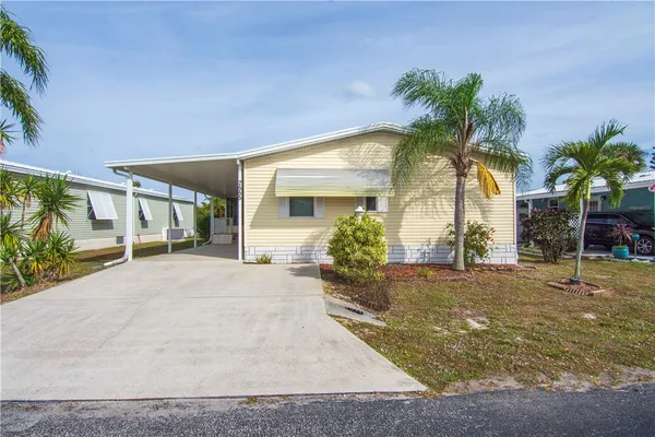 a house with palm trees in front of it
