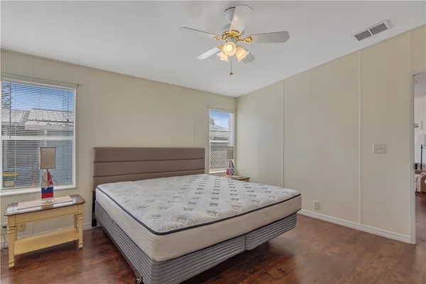 a bedroom with two beds and a dresser