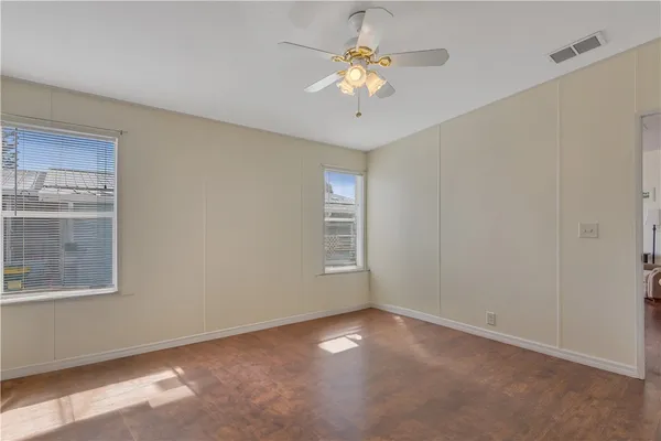 a work room with furniture and wooden floor