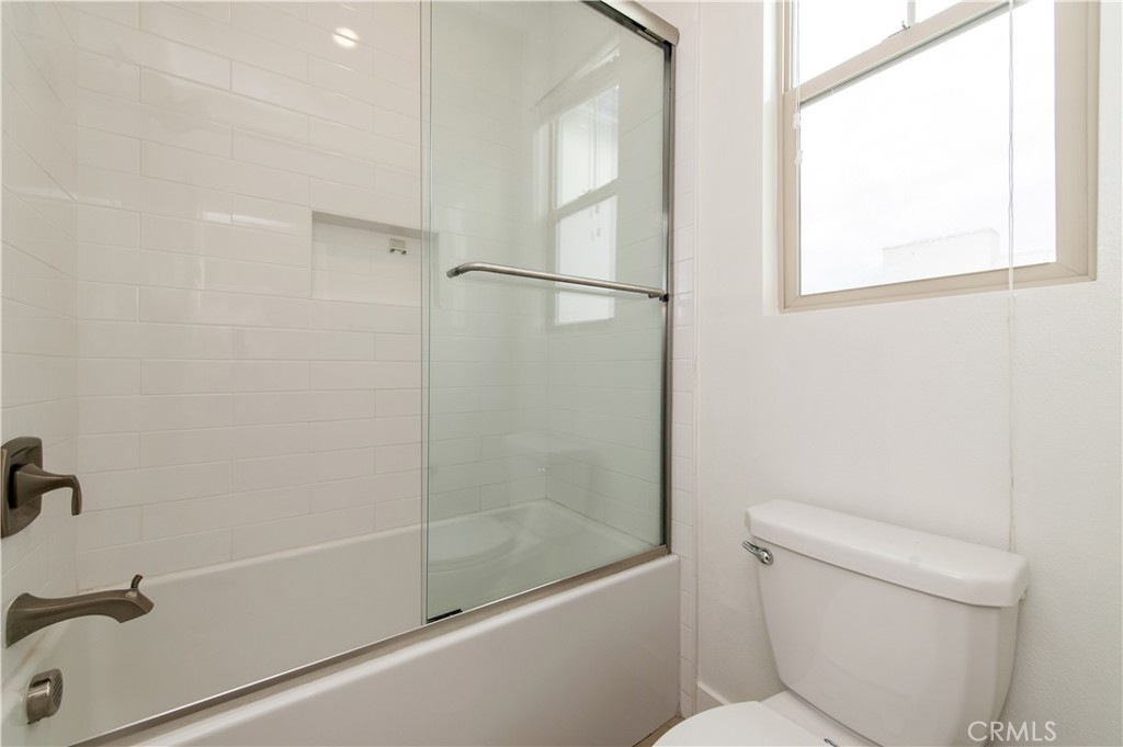 158 Scale Irvine, CA 92618 - Photo 13 of 23 a bathroom with a shower and a toilet
