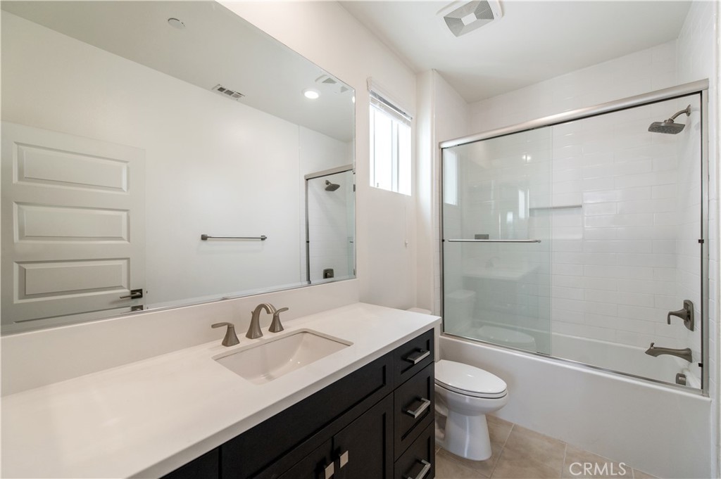 158 Scale Irvine, CA 92618 - Photo 17 of 23 a bathroom with a sink a toilet and shower