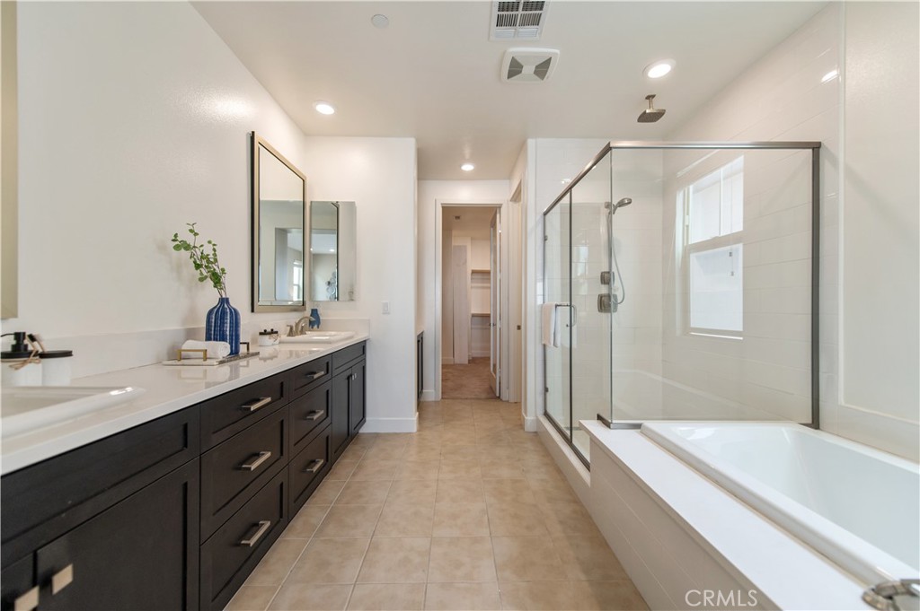 158 Scale Irvine, CA 92618 - Photo 19 of 23 a spacious bathroom with a shower tub double sink and mirror