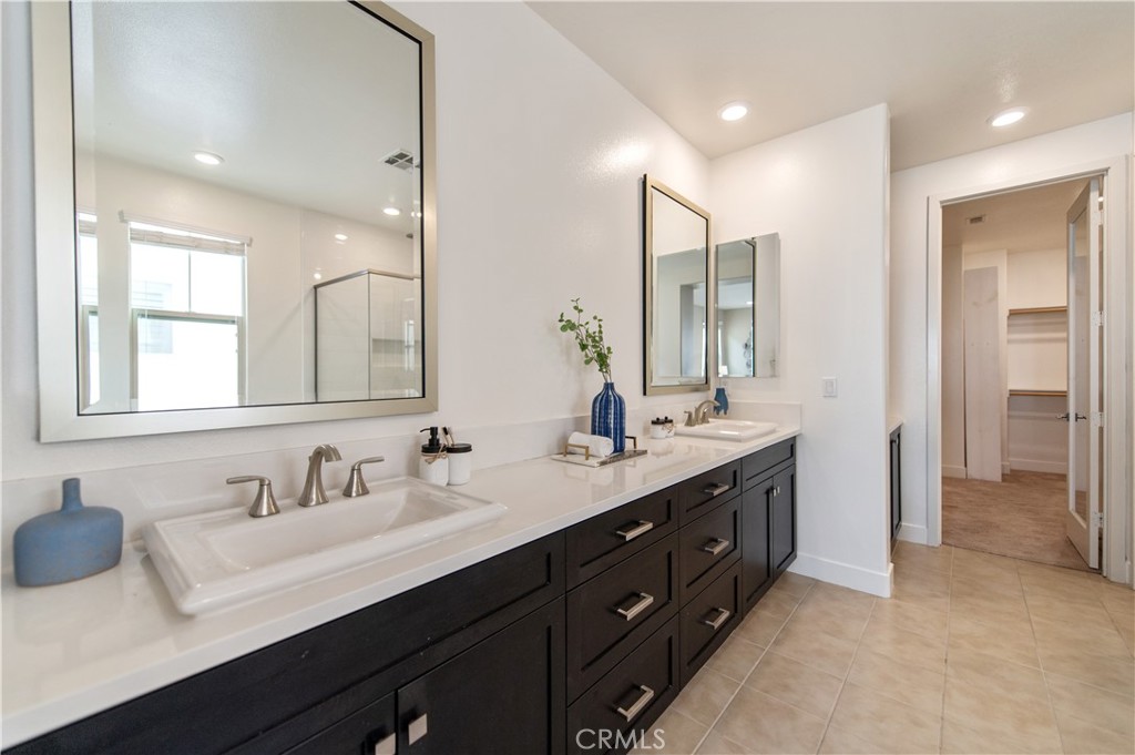 158 Scale Irvine, CA 92618 - Photo 21 of 23 a bathroom with a sink vanity granite tub and a mirror