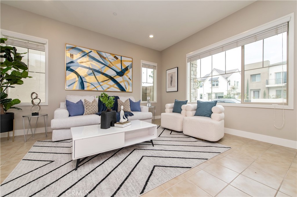 158 Scale Irvine, CA 92618 - Photo 7 of 23 a living room with fireplace furniture and a large window