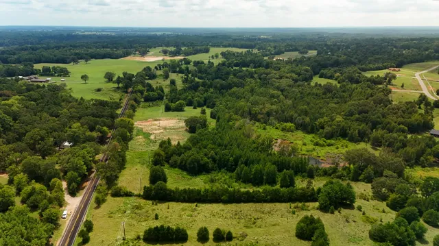 a view of a lake with a yard